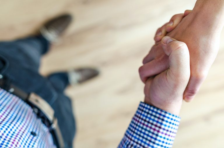 Close up of two hands shaking